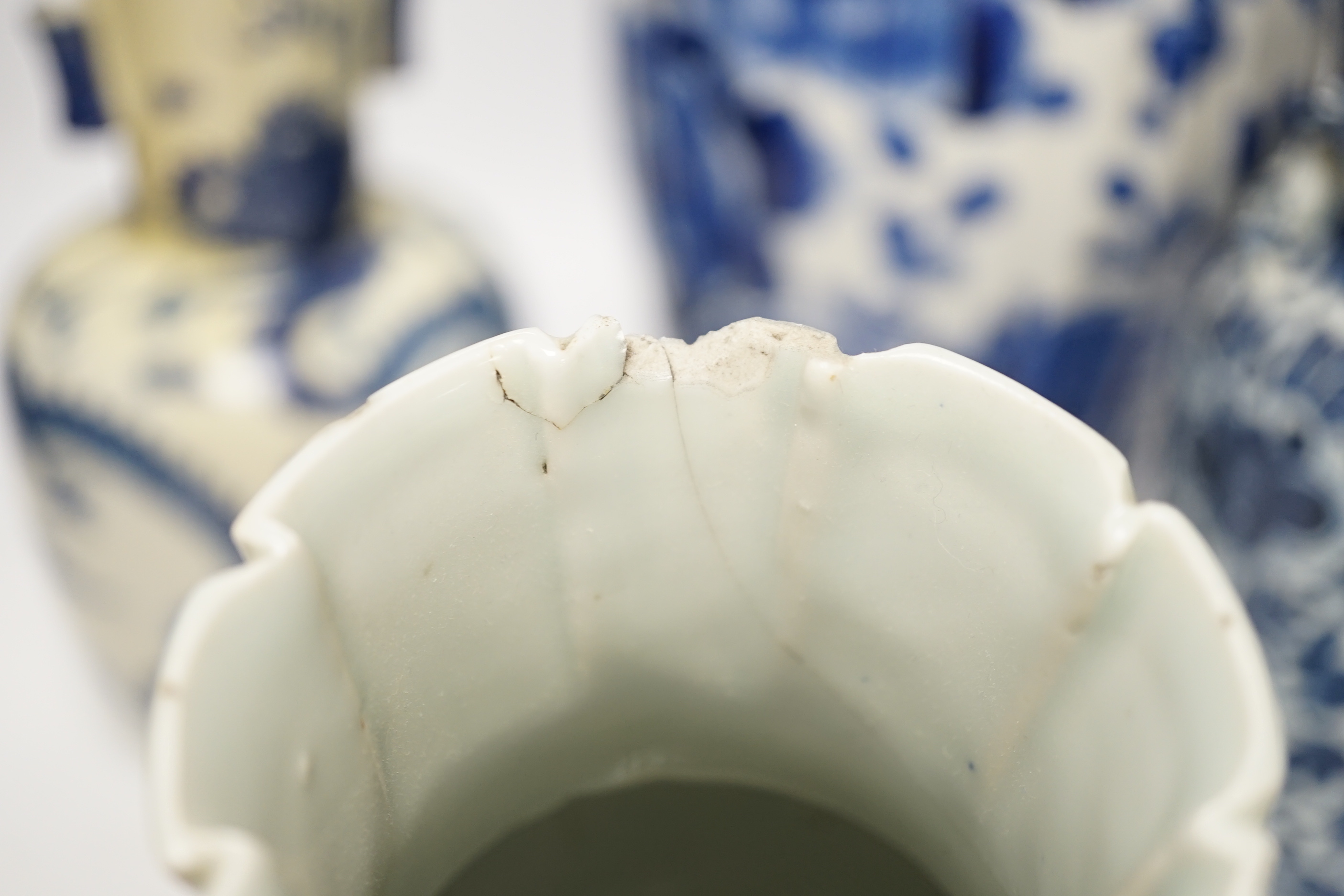 Three 19th century Chinese blue and white vases including a floral pair and a Japanese vase, largest 39cm high